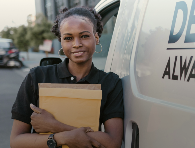 a person holding a file and smiling