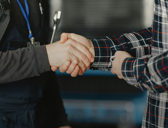 a person shaking hands with another person