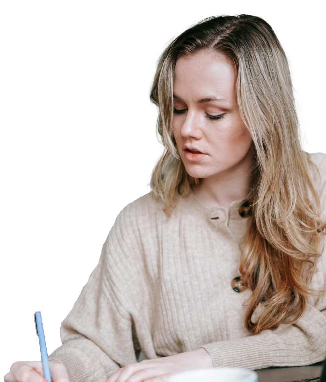 a person writing on a paper