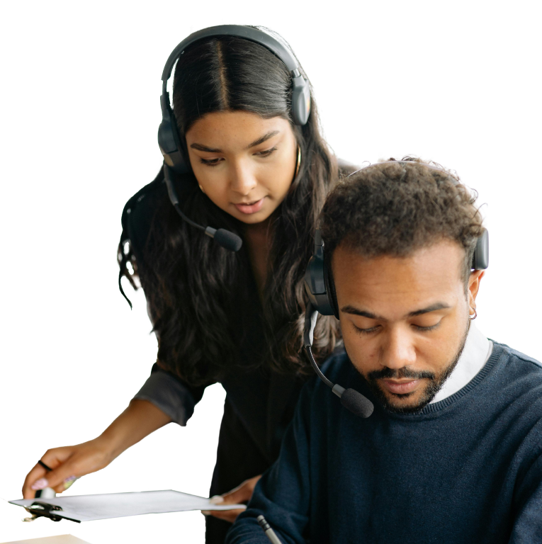 a person holding a pen and looking at a person wearing headphones