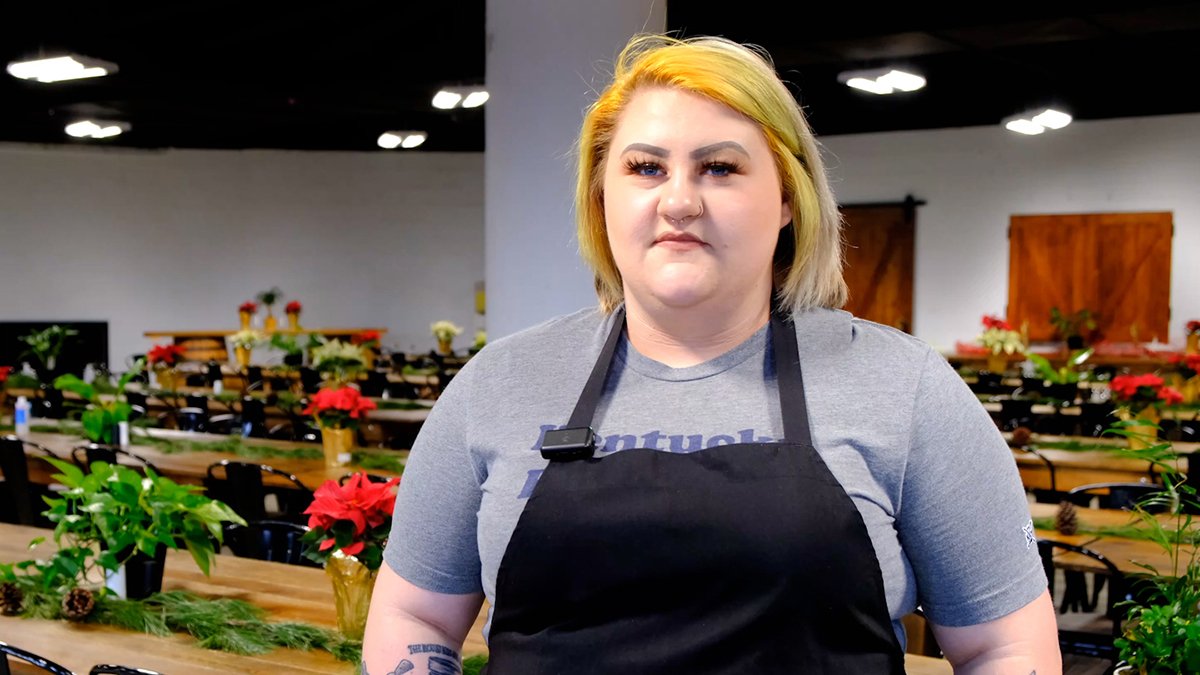 a person wearing a black apron