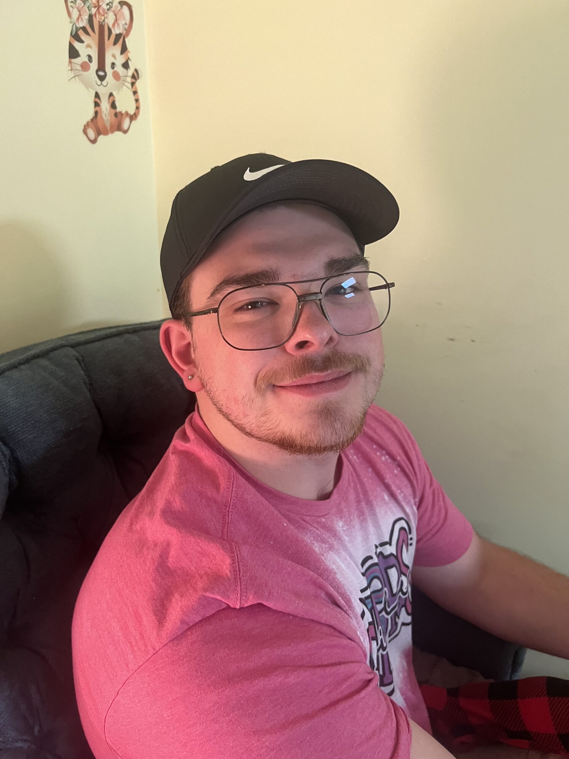 a person wearing glasses and a hat