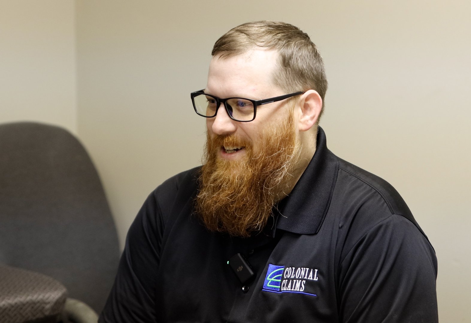 a person with a beard and glasses