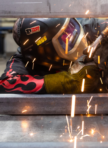 a person welding with sparks