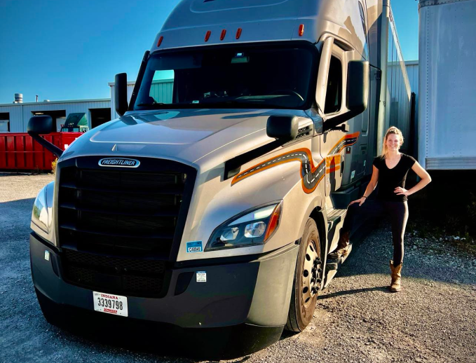 a person standing next to a truck