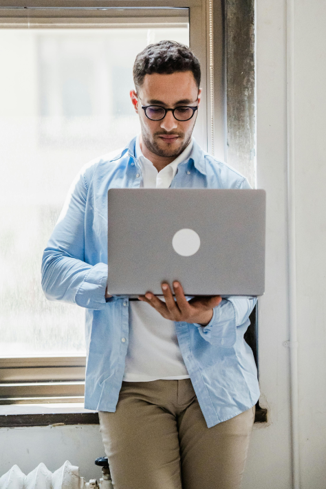 a person holding a laptop