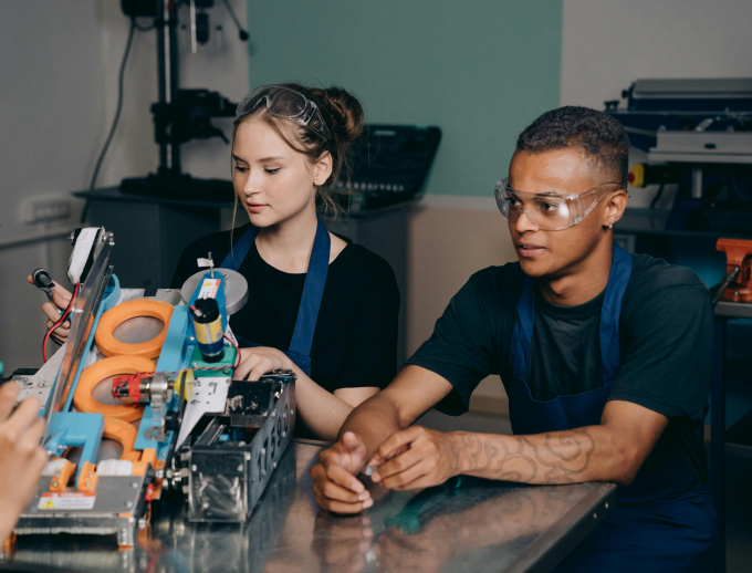 a person and person working on a machine